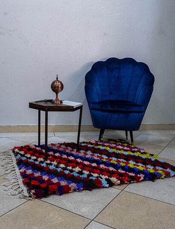 Handmade colorful Moroccan rug adding vibrant decor to a living room