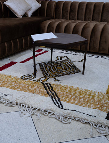 White Moroccan rug with a unique lizard design enhancing a living room decor.